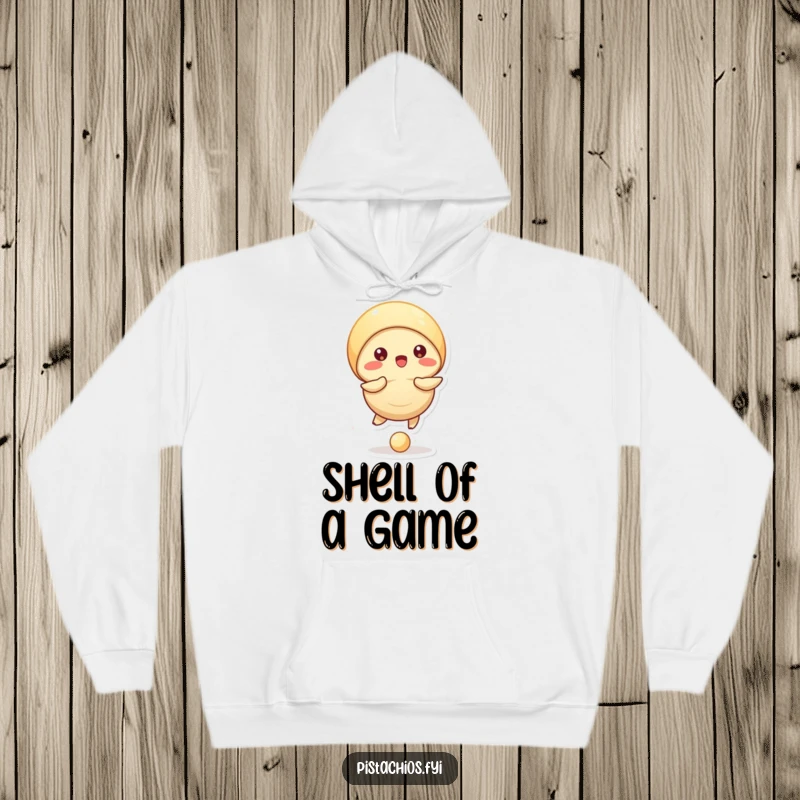 Funny hoodie design: a pistachio character focused on bouncing a small ball with its shell, showing coordination and fun.