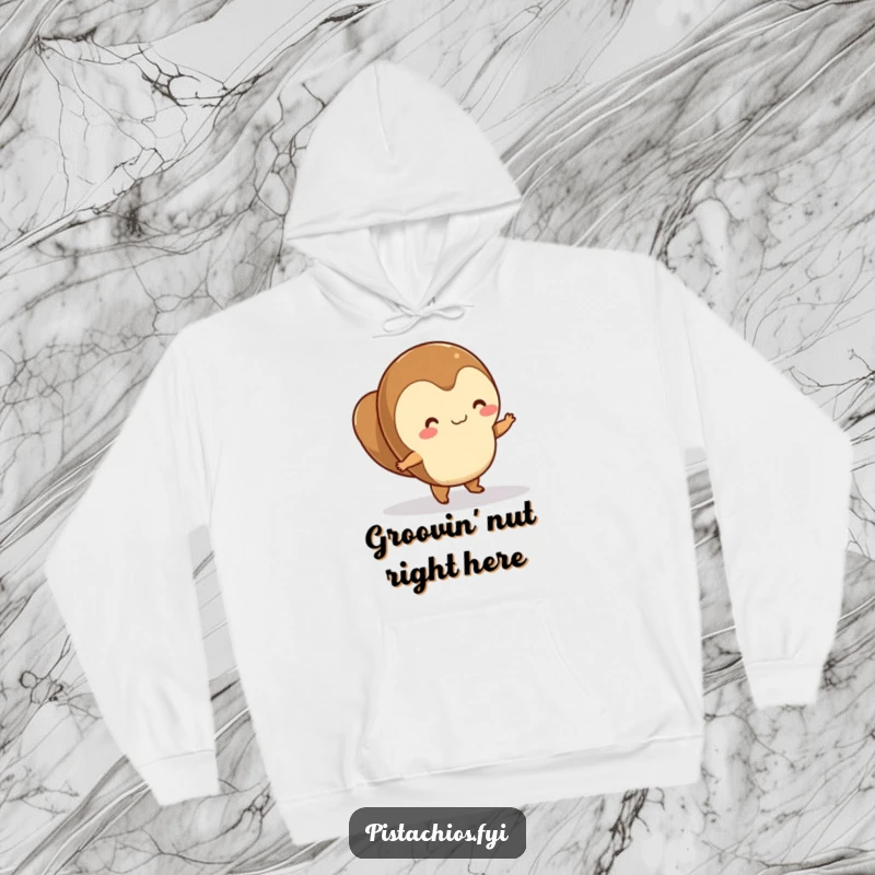Funny hazelnut character dancing merrily on a smooth surface, featured on a warm, comfortable hoodie.