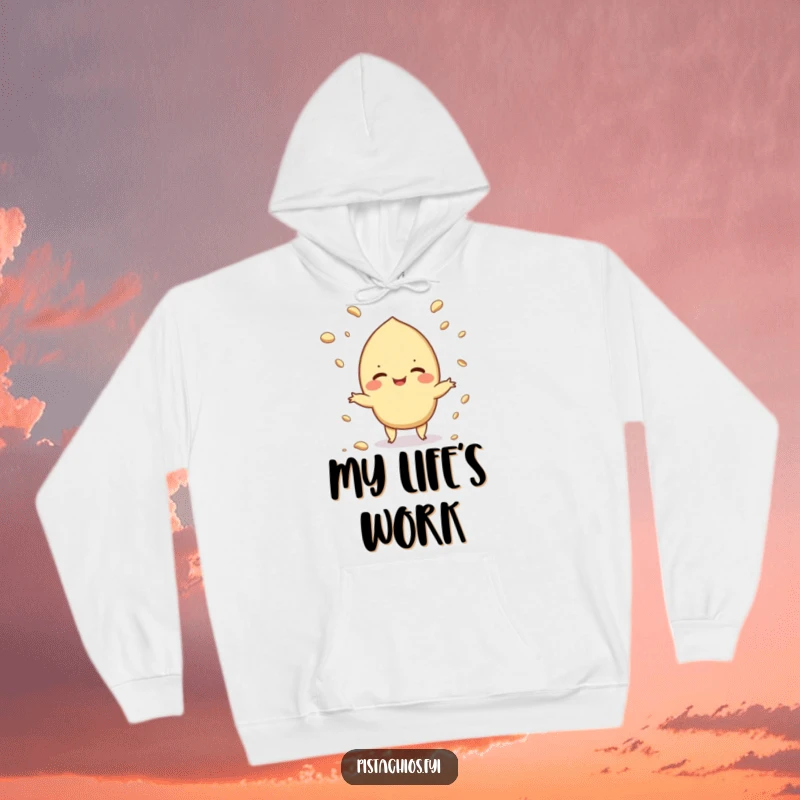 Funny hoodie featuring a giggling pistachio juggling crumbs, perfect for staying warm while embracing a little mess.