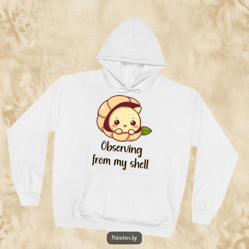 Funny hoodie with a pistachio character peeking curiously from its shell, offering warmth and nutty intrigue.