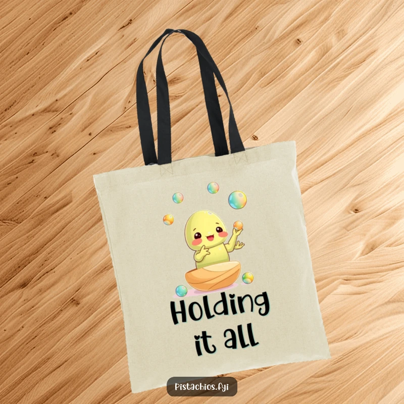 Funny tote bag: a pistachio nut juggling tiny shiny marbles, showcasing impressive dexterity and snack appeal.